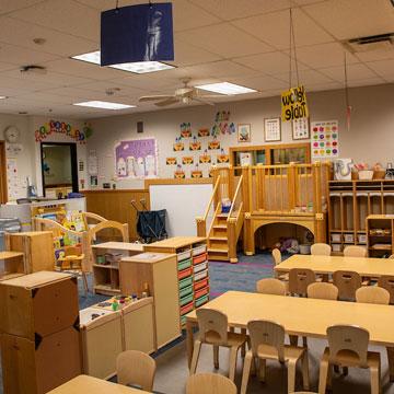 Young Preschool Classroom, highlighting the loft, quiet area, and manipulatives. 